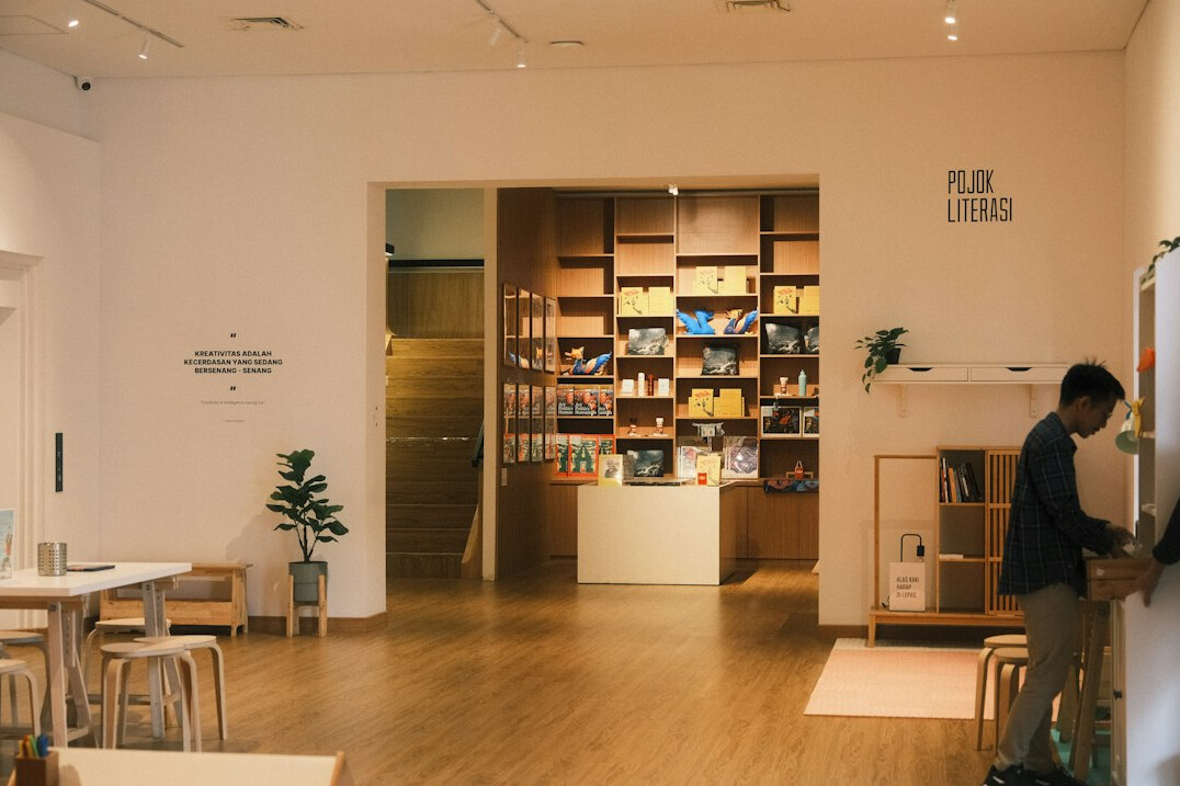 Man reading a book alone in a quiet corner