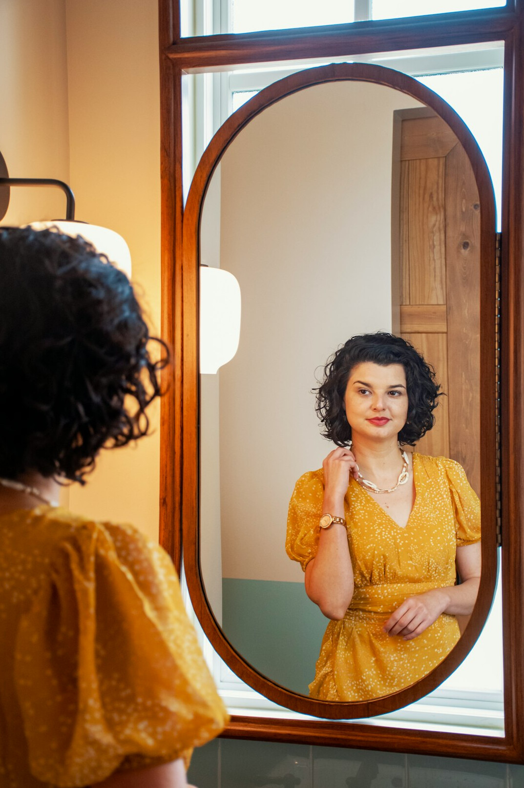 person reflecting in mirror